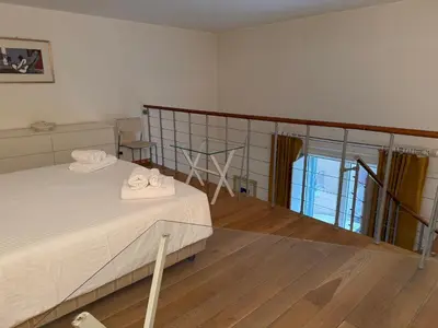 a bedroom with a bed with towels on it at La casa delle stelle in Palermo