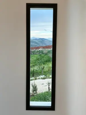 a window with a view of a desert at Villa Muntaja in Scopello