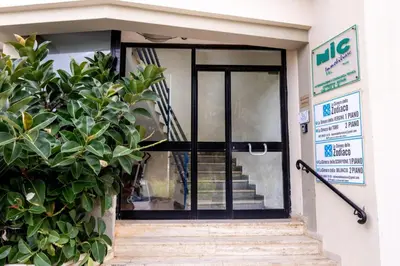 an entrance to a building with a glass door at A due passi dal mare in Palermo