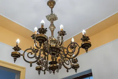 a chandelier hanging from a ceiling at Casa Botanica Apartment in Palermo