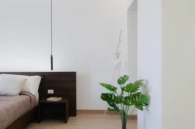 a living room with a couch and a plant at Casabea in Palermo