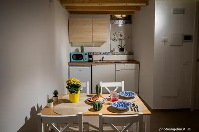 a table with plates of food on it in a room at Borgo La Chiusa in Castellammare del Golfo