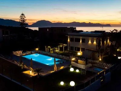 a view of a swimming pool at night at Apartment Lila Wohnung mit Schwimmbad und Meerblick by Interhome in Balestrate