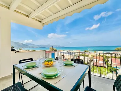 a dining table with a view of the ocean at Apartment Sea Life Giulia- 200 m vom Strand entfernt by Interhome in Alcamo Marina