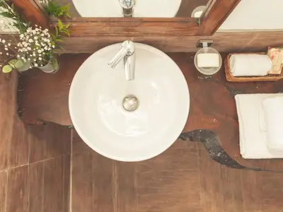 a white sink in a bathroom with a mirror at Apartment Wohnung Glicine mit Schwimmbad und Meerblick by Interhome in Balestrate