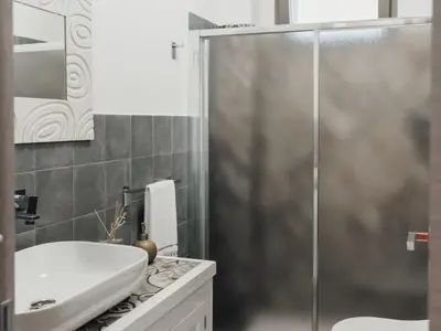 a bathroom with a shower and a sink at Holiday Home Haus in Balestrate mit privatem Parkplatz by Interhome in Balestrate