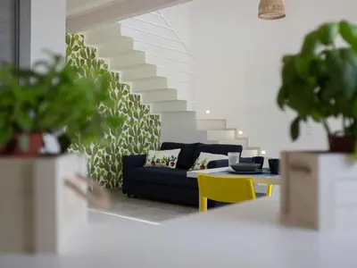 a living room with a couch and a table at Holiday Home in Partinico mit Privatem Pool by Interhome in Balestrate