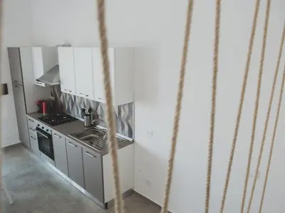 a small kitchen with a sink and a stove at Holiday Home in Partinico mit Privatem Pool by Interhome in Balestrate