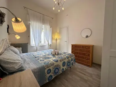 a bedroom with a bed and a dresser and a window at Holiday Home Villa Oasi- 50 m vom Strand entfernt- klimatisiert by Interhome in Alcamo