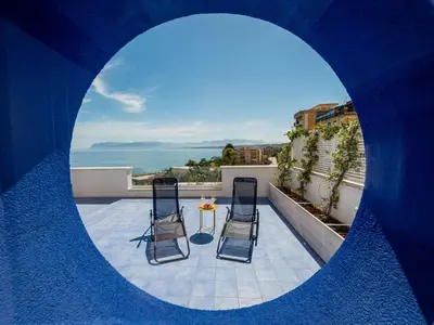 a circular view of a balcony with chairs and a table at Apartment BluOltremare-Terrasse by Interhome in Castellammare del Golfo