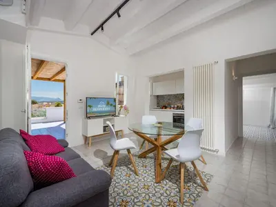 a living room with a couch and a table at Apartment BluOltremare-Terrasse by Interhome in Castellammare del Golfo