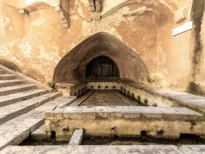 an old building with stairs and a stone archway at Holiday Home Villa mit Wasserblick by Interhome in Campofelice di Roccella