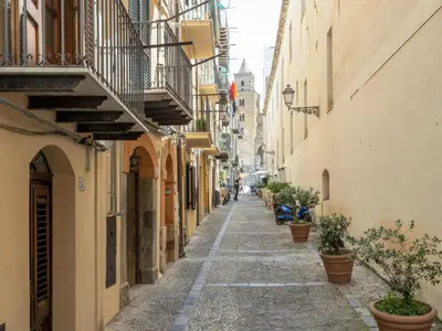 an alley in an old town with potted plants at Holiday Home Ferienvilla mit Wasserblick by Interhome in Campofelice di Roccella