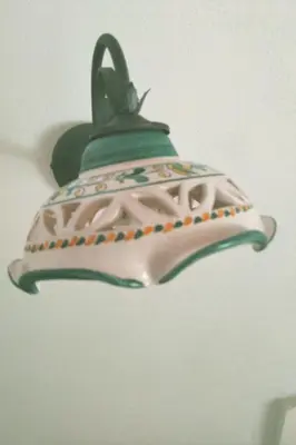 a green and white pot hanging from a ceiling at Holiday Home Manderino-Panoramasuite mit Park und Pool by Interhome in Santa Flavia