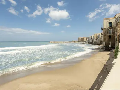a view of a beach with buildings and the ocean at Holiday Home Ferienvilla mit Wasserblick by Interhome in Campofelice di Roccella