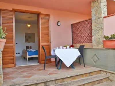 a table and chairs sitting on a patio at Holiday Home Villa mit Wasserblick by Interhome in Campofelice di Roccella