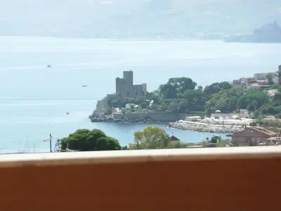 a view of a castle on an island in the water at Holiday Home 'Suite Ficodindia by Interhome in Santa Flavia