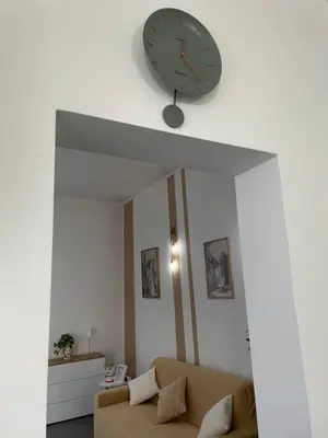 a white room with a table and two chairs at VITALENTA Palermo apartment in Palermo
