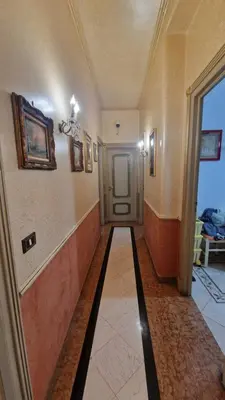 a hallway of a building with a door and a hallwayngth at Casa mogia in Palermo
