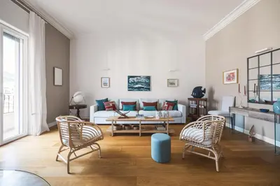 a living room with a couch and two chairs at Giada's House By DomuSicily in Palermo