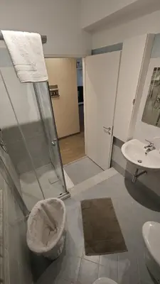 a bathroom with a shower and a toilet and a sink at Profumo di casa 2 in Lascari