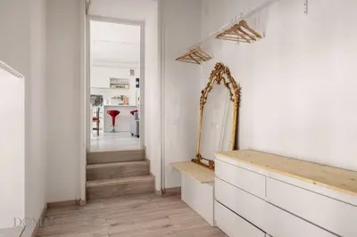 a hallway with a mirror and a dresser in a room at Loggiato dei Ventimiglia By DomuSicily in Palermo