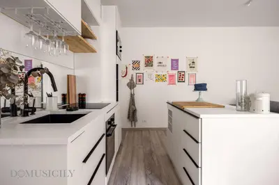 a kitchen with white cabinets and a sink at Loggiato dei Ventimiglia By DomuSicily in Palermo
