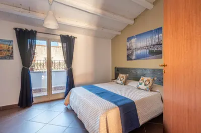 a bedroom with a bed and a window at Casa Peppa by Wonderful Italy in Palermo