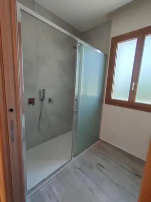 a shower with a glass door in a bathroom at Brezza Marina in Alcamo