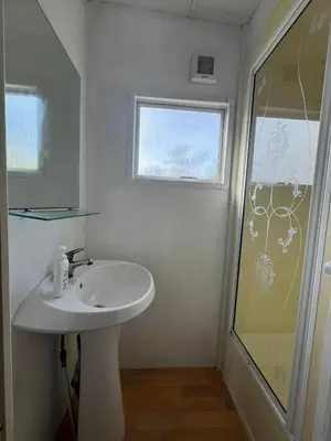 a bathroom with a sink and a shower at Casa Allegra in Termini Imerese
