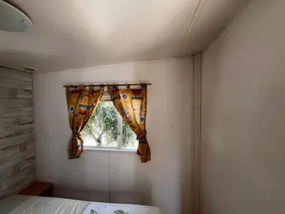 a bedroom with a bed and a window at Casa Allegra in Termini Imerese