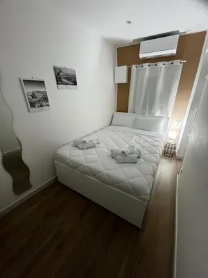 a small bedroom with a bed and a window at A CASA DI LILLY - BALLARò' - in Palermo