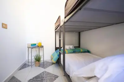 a bedroom with a bed in a room with at iFlat Casa Sant'Agata in Palermo