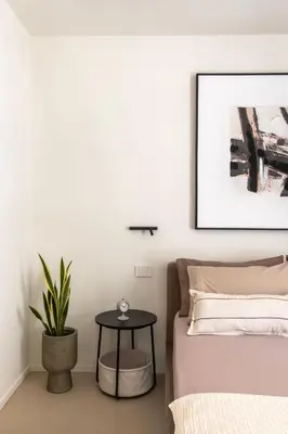 a bedroom with a bed and a table at Casa Marella in Balestrate