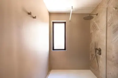 a bathroom with a shower and a window at Casa Marella in Balestrate