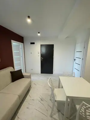 a living room with a couch and a table at Nela in Carini