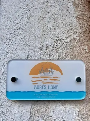 a sign on the side of a building at Auri's home in Palermo