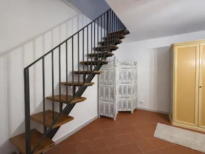 a spiral staircase in a room with white walls at Dal Moro in Palermo