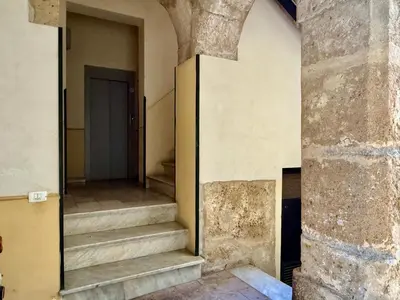 an empty hallway with stairs in a building at Dal Moro in Palermo