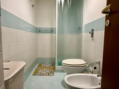 a bathroom with a toilet and a shower and a sink at Dal Moro in Palermo