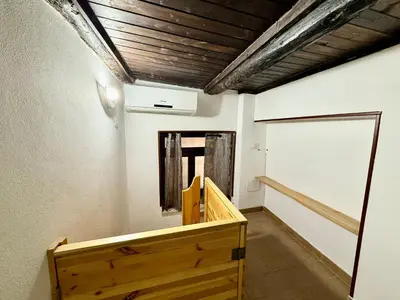 a hallway of a room with a wooden ramp and a door at Casa del Cortile Secco in Palermo