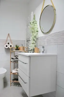 a white bathroom with a sink and a mirror at Villa del sole in Carini