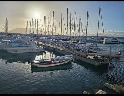 a group of boats are docked in a harbor at Enza HOUSE in Balestrate