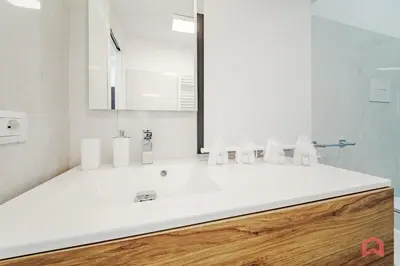 a bathroom with a white sink and a mirror at Elegant Villa with Pool in Castellammare del Golfo