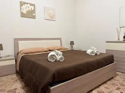 two stuffed animals sitting on top of a bed at Casa Costa in Capaci