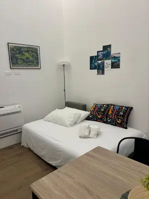 a living room with a couch and a table at Gea Apartment in Palermo