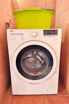 a washing machine with a bucket on top of it at Holiday Home Helle mediterrane Villa mit Veranda und Garten by Interhome in Cefalù