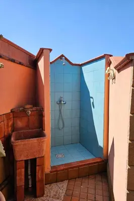 a bathroom with a shower and a sink at Holiday Home Helle mediterrane Villa mit Veranda und Garten by Interhome in Cefalù