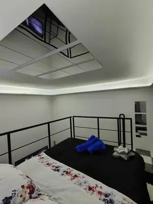 a bedroom with a bed with a blue towel on it at Magic House in Palermo