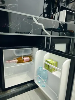 an open refrigerator with some food and drinks in it at Magic House in Palermo